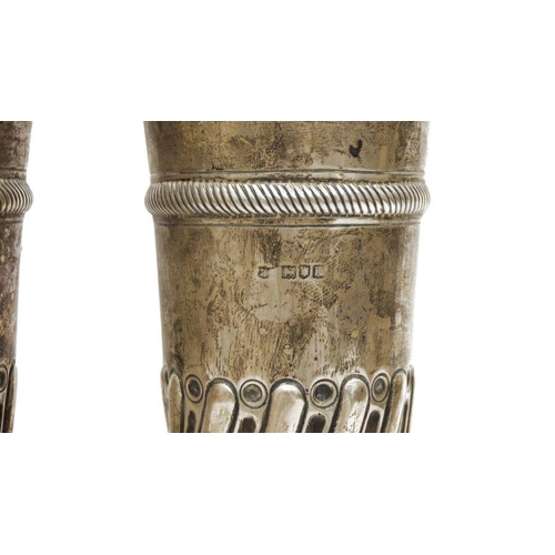 306 - Pair of Victorian large silver vases, cylindrical repousse decorated on circular feet, London 1897 a... 