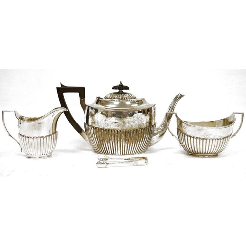 307 - Early 20th century three-piece silver teaset comprising teapot, two-handled sugar bowl and milk jug,... 