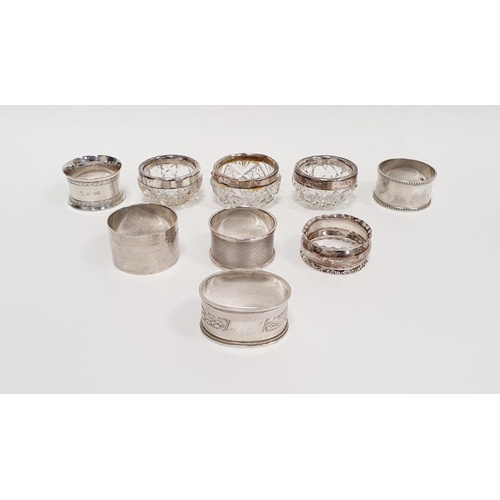 352 - Three silver-rimmed cut glass personal salts and six various silver napkin rings