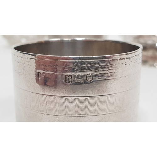 352 - Three silver-rimmed cut glass personal salts and six various silver napkin rings