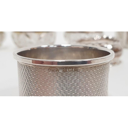352 - Three silver-rimmed cut glass personal salts and six various silver napkin rings