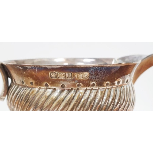 354 - Edwardian silver cream jug, cylindrical, footed and semi-gadrooned, Sheffield 1903, 9cm high