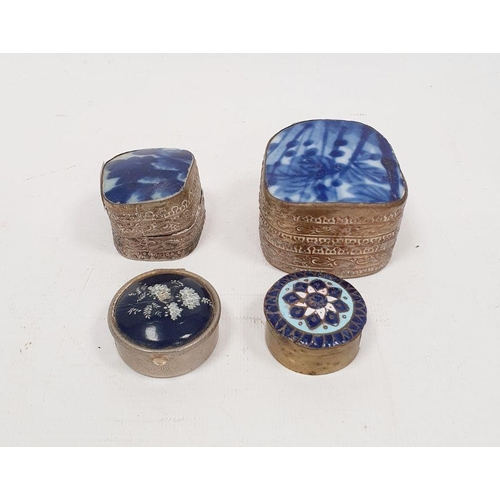 363 - Two Oriental silver-coloured trinket boxes with white ceramic insert to lid, repousse decorated, 5.5... 