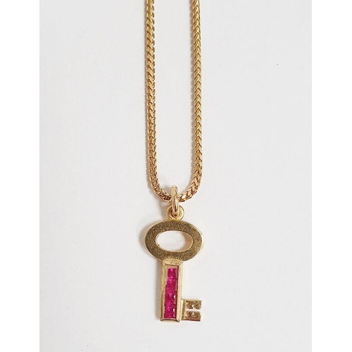 388 - Theo Fennell 18K gold and ruby miniature key-pattern pendant and the herringbone-pattern flexible ch... 