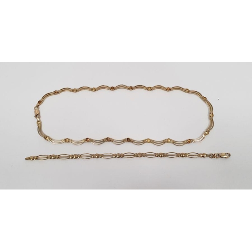 394 - 9ct gold pierced collarette necklace and matching bracelet, 19.5g total approx.