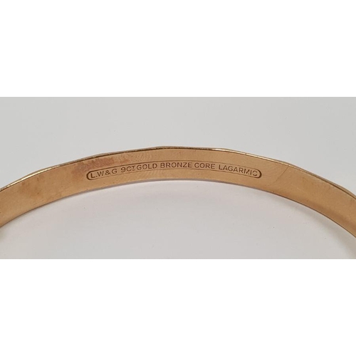 401 - 9ct gold bronze core bangle, a rolled gold chain bracelet with padlock clasp, a 9ct gold and metal f... 