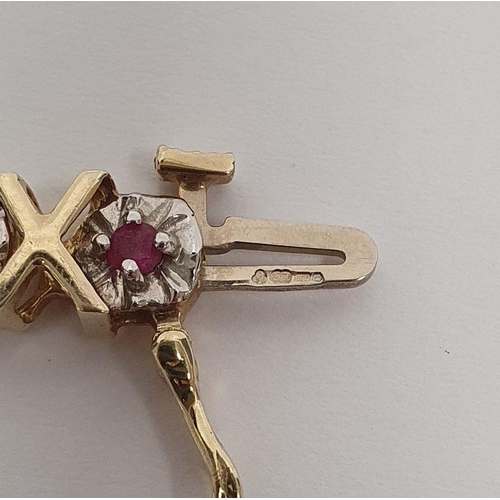 402 - 9ct gold bracelet set with ruby and diamonds, the gold in a cross-shaped pattern, 10.5g approx.
