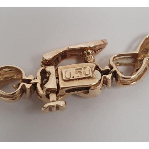 403 - 9ct gold bracelet set with tiny diamonds, marked on the clasp 0.50