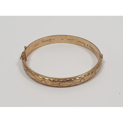 404 - 9ct gold bangle with engraved decoration, inscribed to the inside 'Today and Forever Love Danny 1999... 