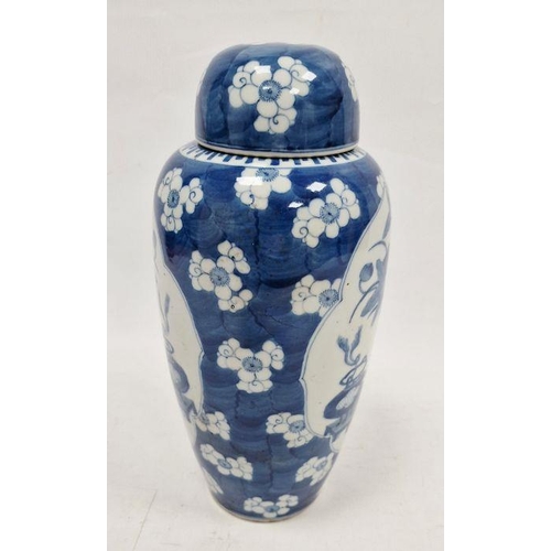 73 - Chinese lidded vase, the body of slight tapering form, blue and white set with panels featuring vase... 