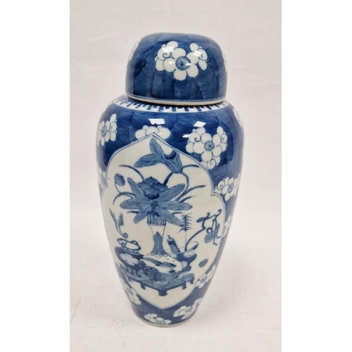 73 - Chinese lidded vase, the body of slight tapering form, blue and white set with panels featuring vase... 