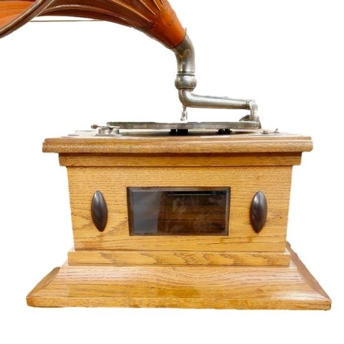 163 - Early 20th century oak cased pathephone with meltrope sound box and orange fluted horn, 35.5cm wide ... 