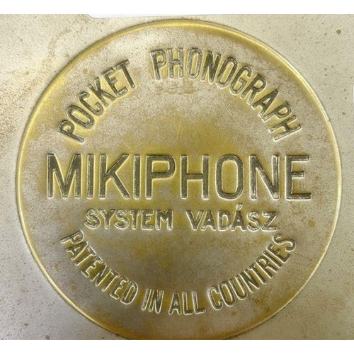 165 - A Mikiphone pocket phonograph in 11.5cm diameter tin with The Play Pictorial advertising 'At last a ... 