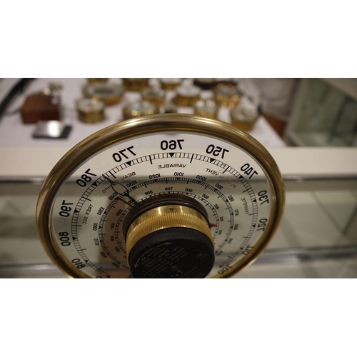 197A - Mid 20th century Jaeger desk barometer, of circular form, with gilt metal frame, the dial with a cen... 