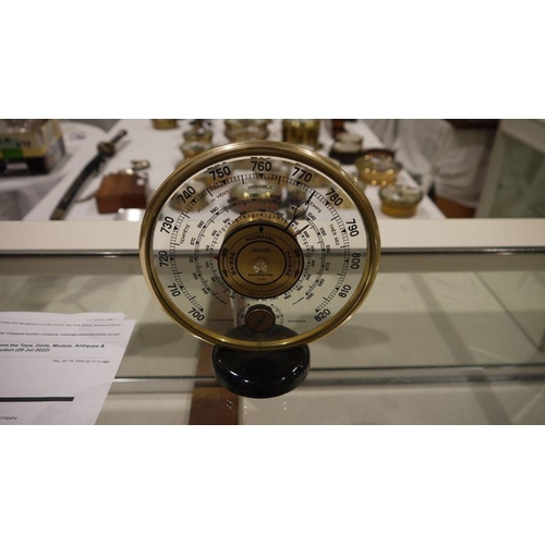 197A - Mid 20th century Jaeger desk barometer, of circular form, with gilt metal frame, the dial with a cen... 