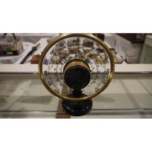 197A - Mid 20th century Jaeger desk barometer, of circular form, with gilt metal frame, the dial with a cen... 