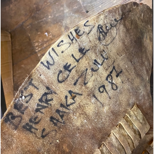 282 - Reproduction Zulu shield and weapon display signed by South African actor Henry Cele with inscriptio... 