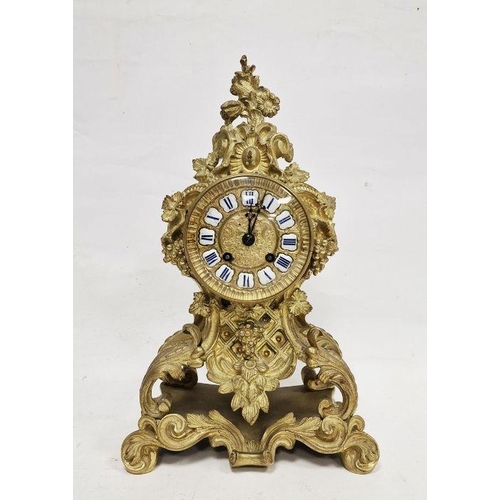 1001 - French mantel clock in a gilt metal rococo style body, Roman enamel numerals to the dial, the glazed... 