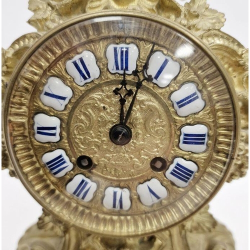 1001 - French mantel clock in a gilt metal rococo style body, Roman enamel numerals to the dial, the glazed... 