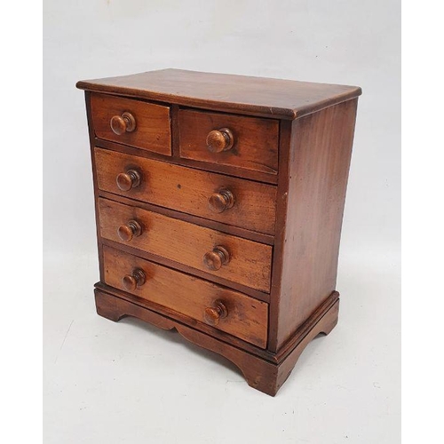 1022 - Miniature stained pine chest of two short over three long drawers with turned bun handles, 37cm x 33... 