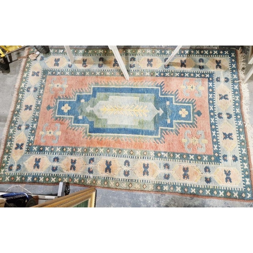 1028 - Large Turkish orange ground wool pile rug with large centralised geometric medallion surrounded by m... 