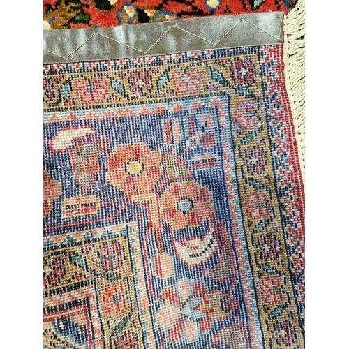 1044 - North West Persian Mahal red ground rug with central flowerhead medallion surrounded by floral spray... 