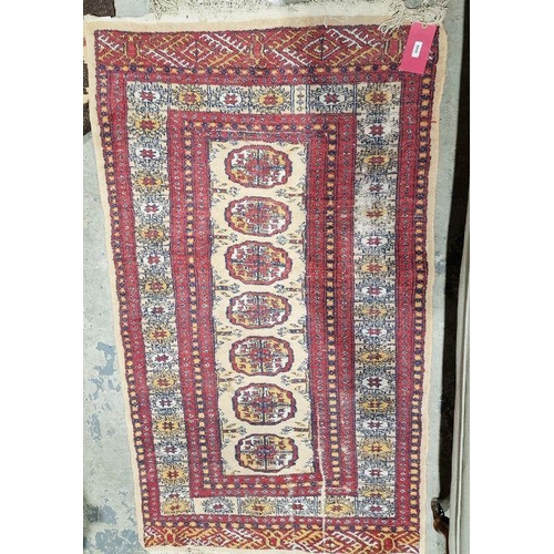 1046 - Modern Eastern style cream ground rug with one row of seven elephant foot guls to multiple geometric... 