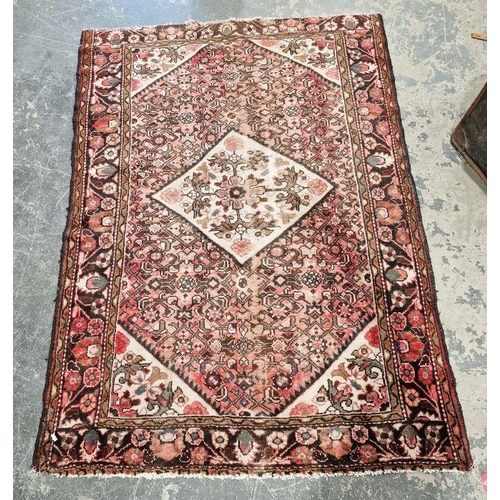 1050 - Large Eastern style pink ground rug with central lozenge medallion on a herati-filled field with mul... 