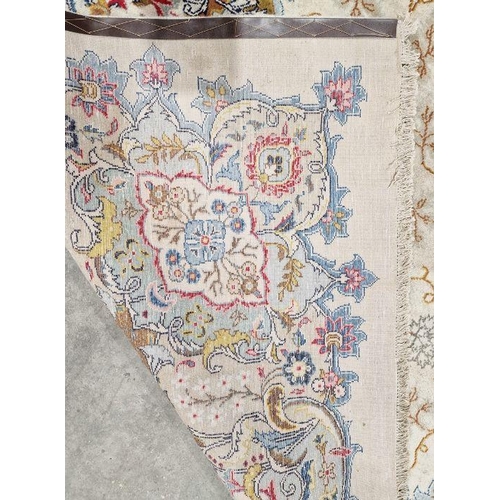 1058 - Central Persian Kashan cream ground carpet with large central floral medallion enclosed by hanging b... 