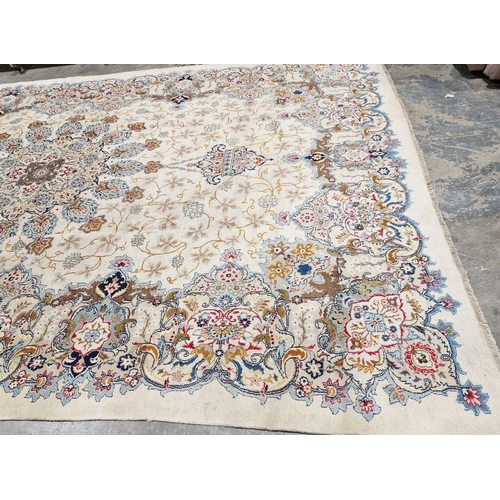 1058 - Central Persian Kashan cream ground carpet with large central floral medallion enclosed by hanging b... 