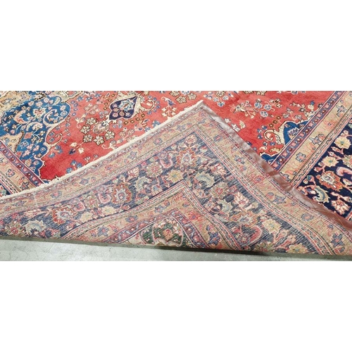 1059 - North West Persian Birjand red ground carpet with central floral medallion enclosed by floral patter... 