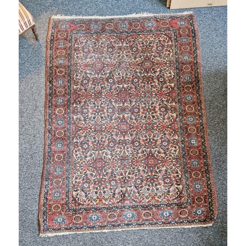 1066 - Eastern style peach ground rug with floral pattern to multiple floral borders, 204cm X148cm