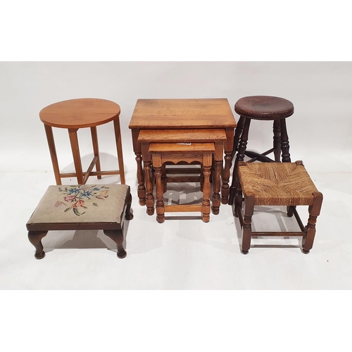 1104 - Modern oak nest of three tables, a square rush seated stool, two further stools and a mid century ne... 