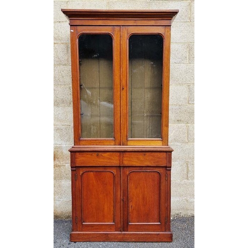 1137 - Edwardian mahogany bookcase with glazed double doors above two frieze drawers and double panelled cu... 