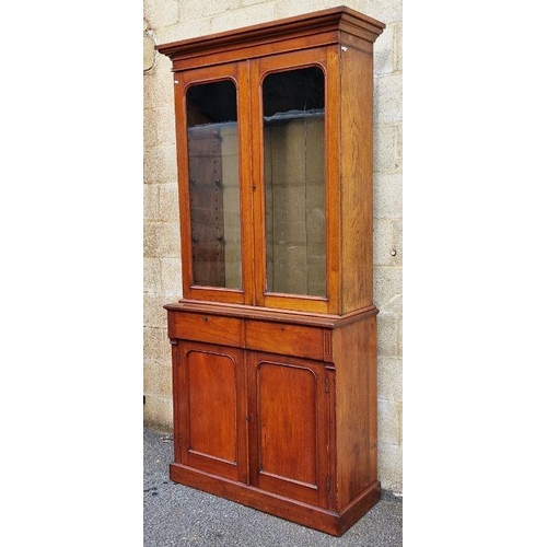 1137 - Edwardian mahogany bookcase with glazed double doors above two frieze drawers and double panelled cu... 