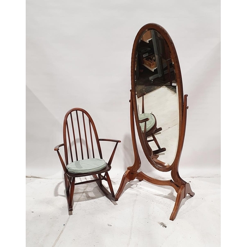 1140 - Early 20th century mahogany-framed oval cheval mirror, 167cm high and an Ercol-style dark stained wi... 