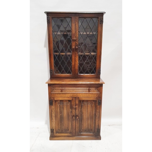 1143 - 20th century oak glazed kitchen cabinet with leaded glazed double doors enclosing two shelves, above... 