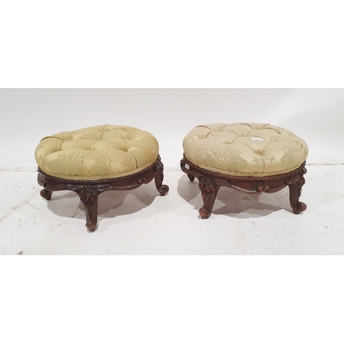 1179 - Pair of Victorian circular low stools the button upholstered pale yellow, carved scroll to four supp... 