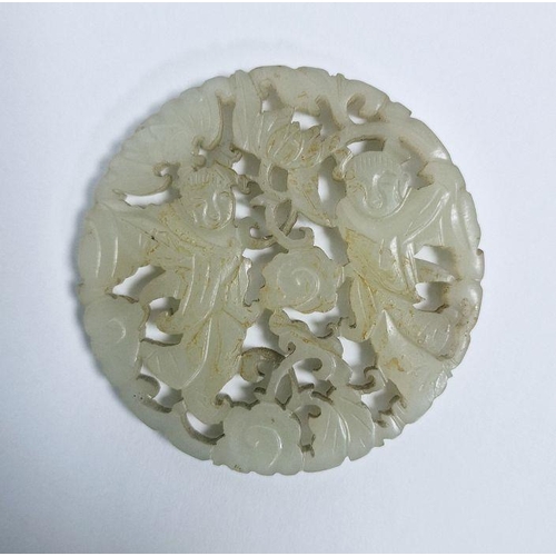 119 - Chinese pale celadon jade carved and pierced disc, bi-carved with two figures amongst scrolling flow... 