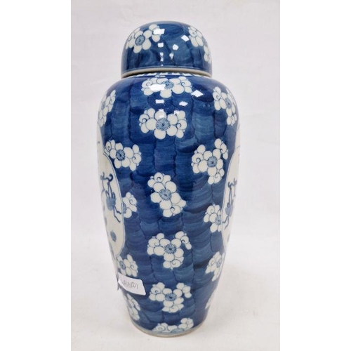 121 - Chinese lidded vase, the body of slight tapering form, blue and white set with panels featuring vase... 