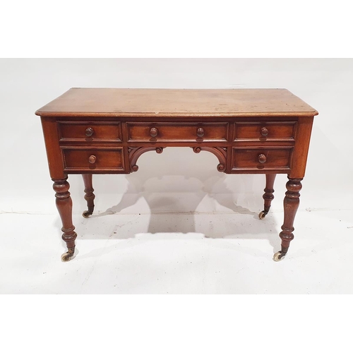 1213 - 19th century mahogany desk, the central drawer above arched carved scrollwork decoration, flanked by... 