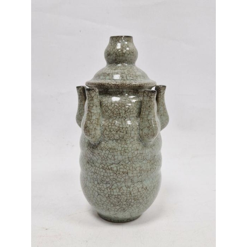 122 - 20th century Chinese flower stem vase in a pale ground celadon crackle glaze, the central stem surro... 