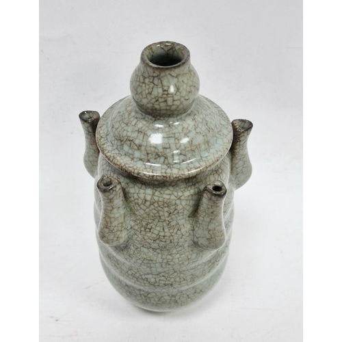 122 - 20th century Chinese flower stem vase in a pale ground celadon crackle glaze, the central stem surro... 