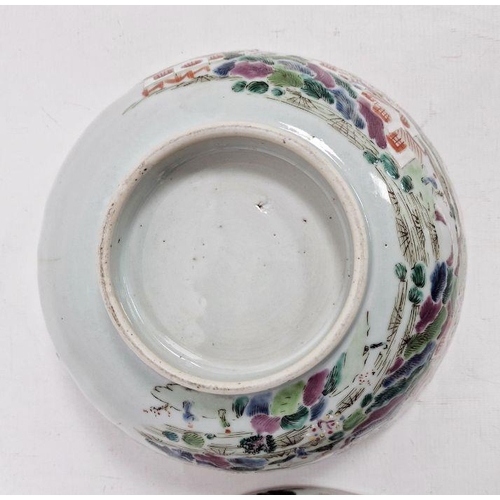 123 - Two Chinese famille rose punchbowls, the first Qianlong, painted with figures in conversation in int... 