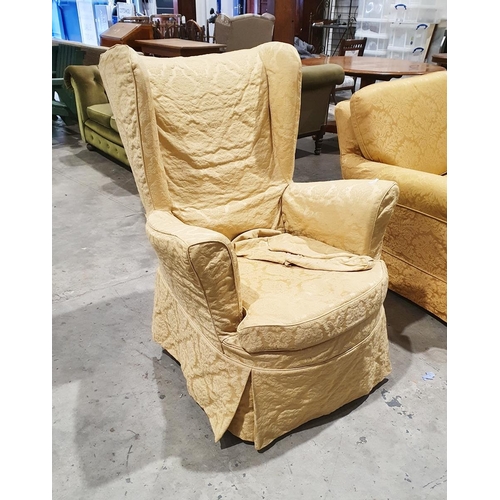 1296 - Early 20th century wing back armchair with gold floral upholstery