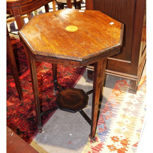 1322 - Edwardian mahogany octagonal two-tier table on castors, inlaid (one castor loose)