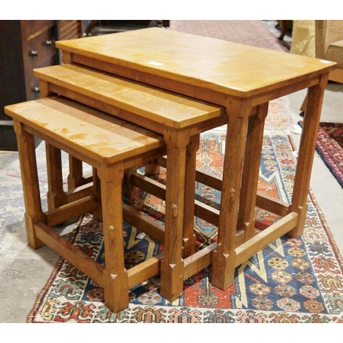 1331 - Nest of three Robert Thompson 'Mouseman' oak trio coffee tables, each rectangular with rounded corne... 