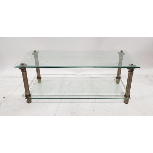 1348 - Late 20th century glass two-tier rectangular coffee table on metal column supports, 108cm x 55cm