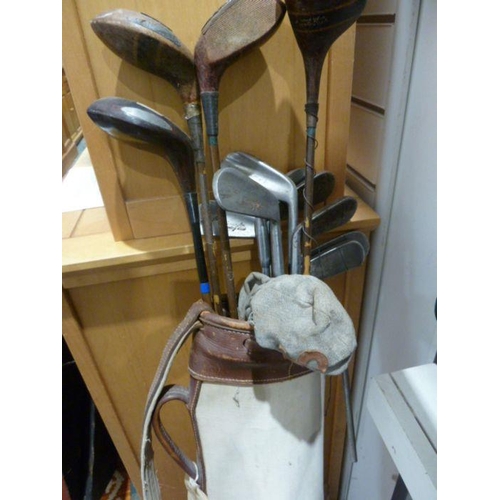 196 - Assorted antique golf clubs in case