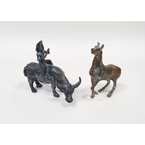 202 - Metal model of a figure riding an ox together with a metal model of a horse (2)